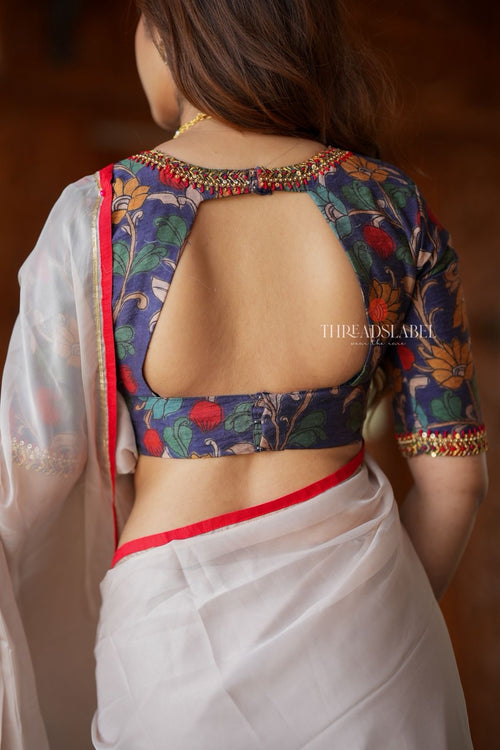 Light beige organza saree with hand work blouse