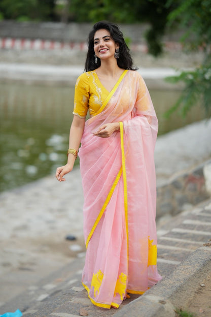 Peach organza saree with yellow hand work blouse