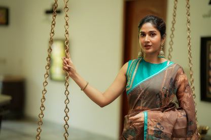 Brown kalamkari kota saree with blue hand work blouse