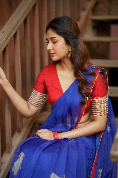 Blue organza cow with red hand work blouse