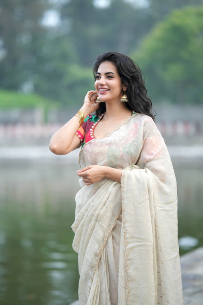 Beige georgette tissue saree with multi hand work blouse