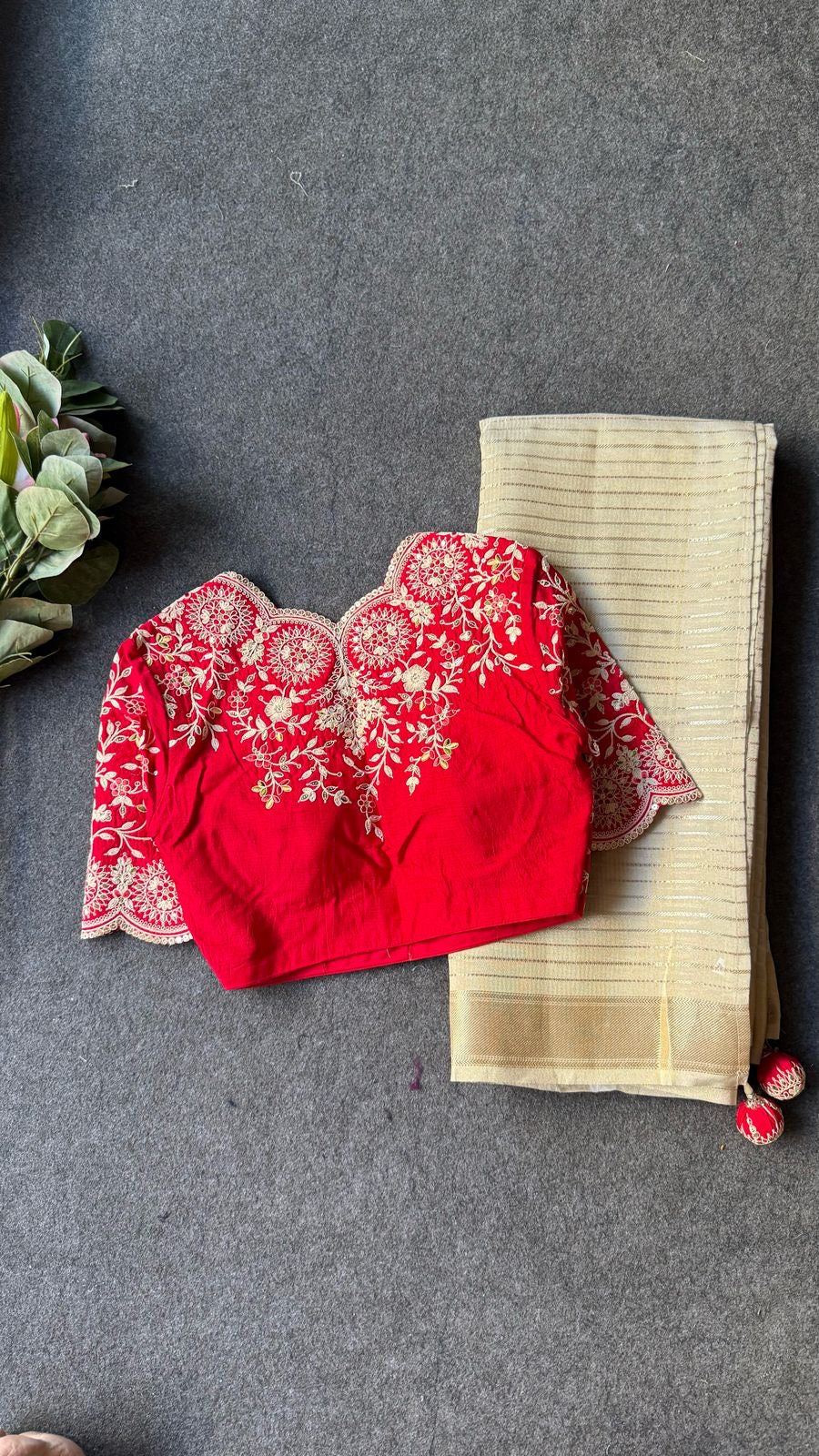 Cream tissue stripped saree with red silk hand work blouse