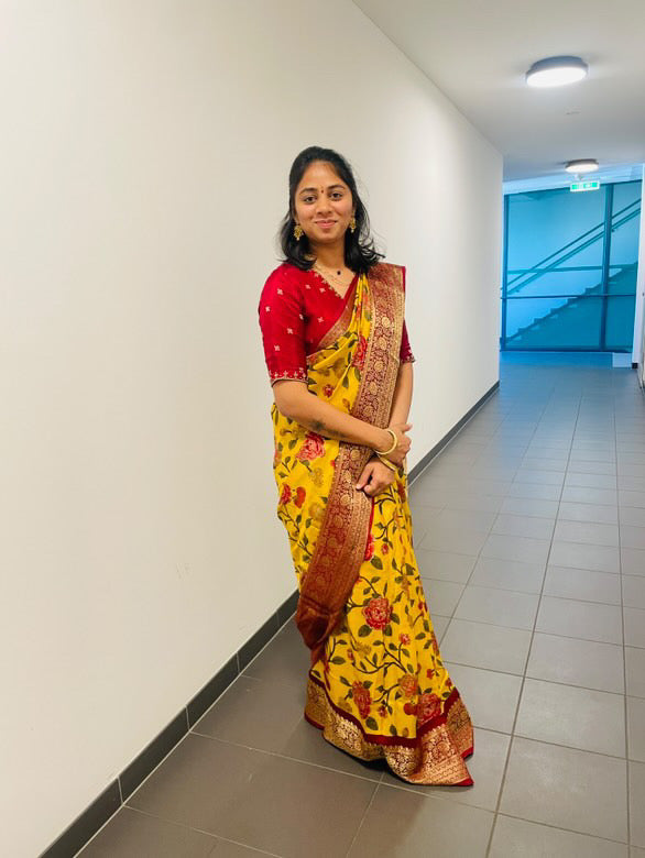 Yellow silk printed saree with hand worked blouse