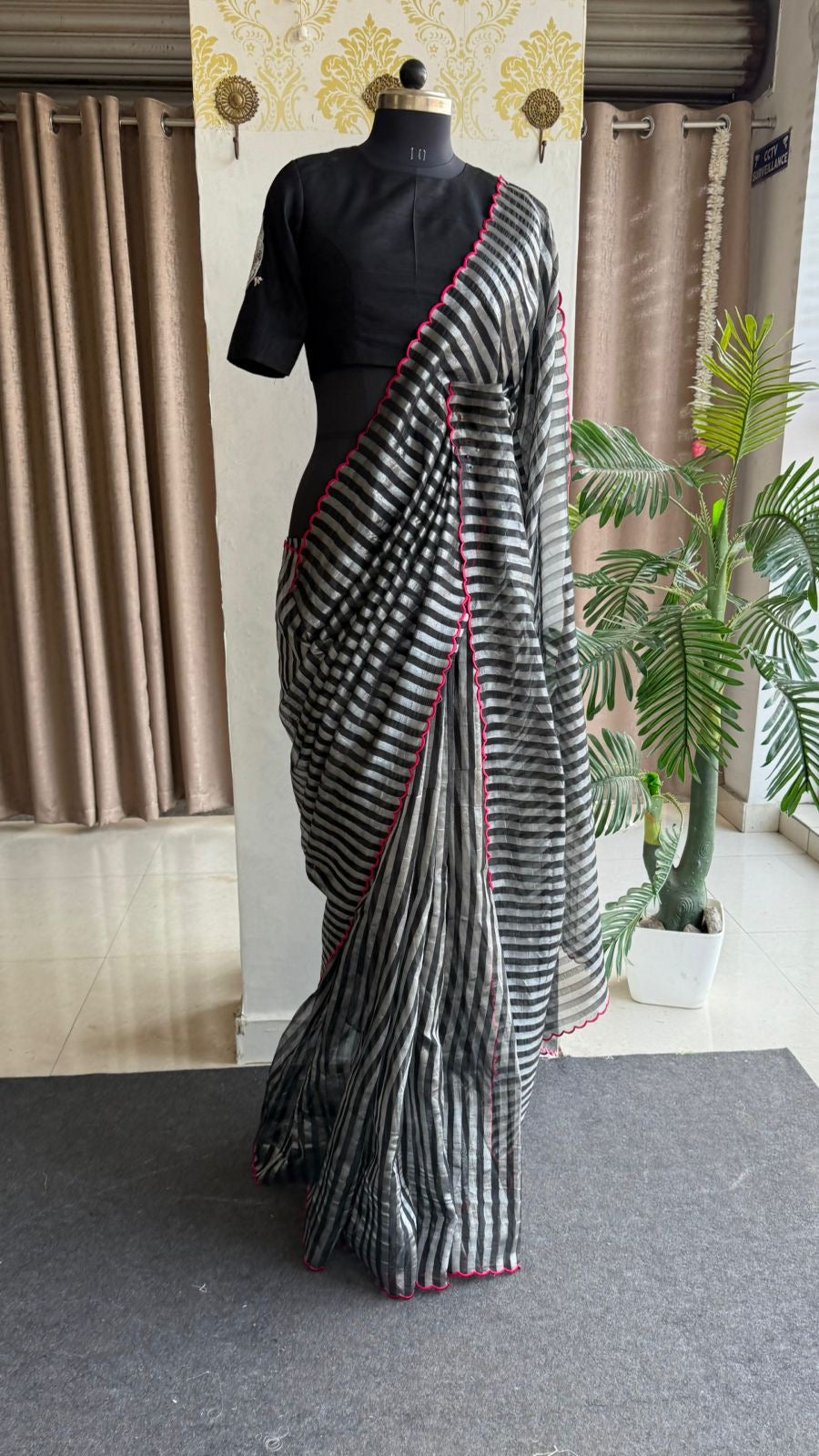 Black & silver stripped tissue saree with bird work blouse