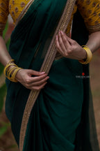 Green organza saree with yellow hand work blouse