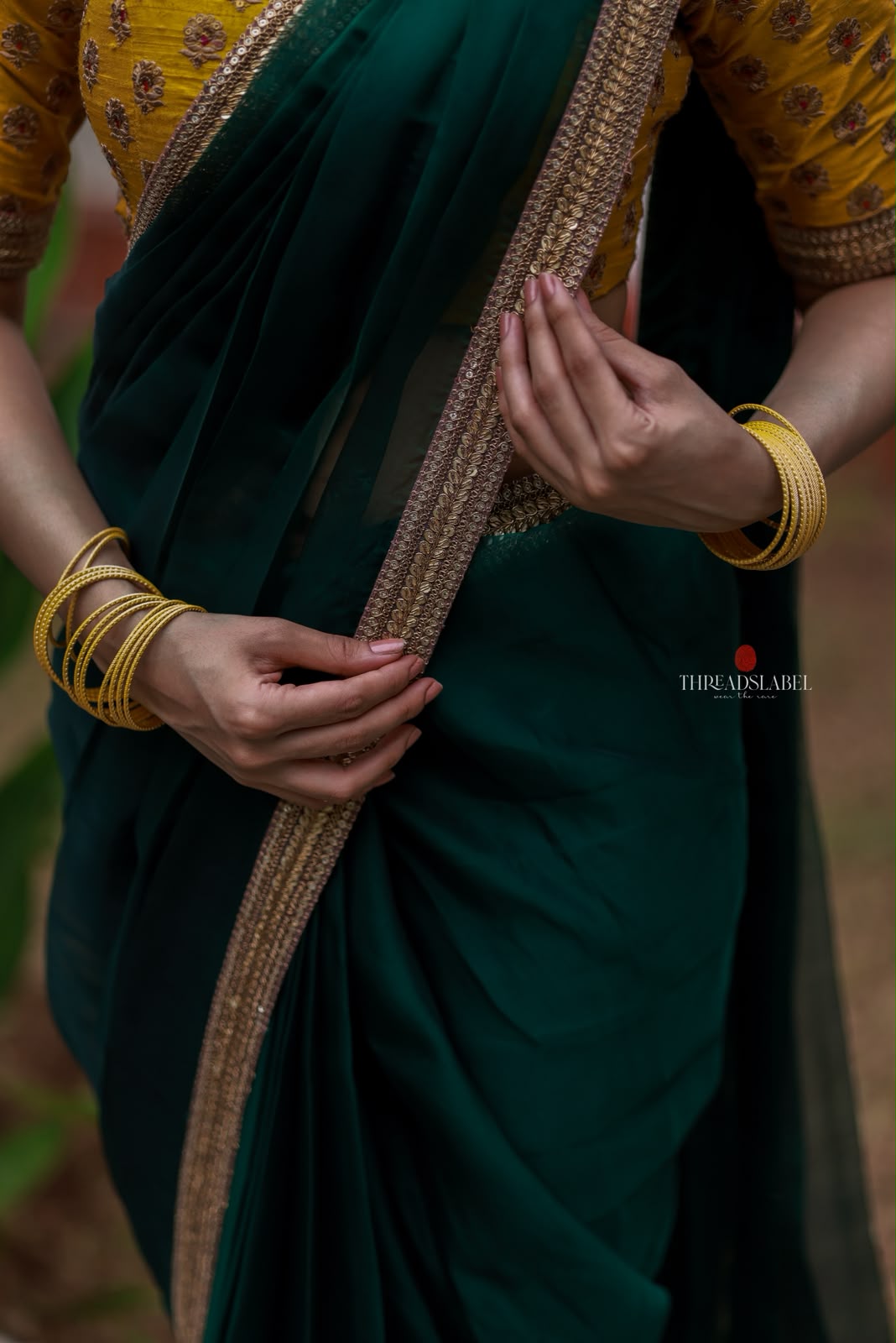 Green organza saree with yellow hand work blouse