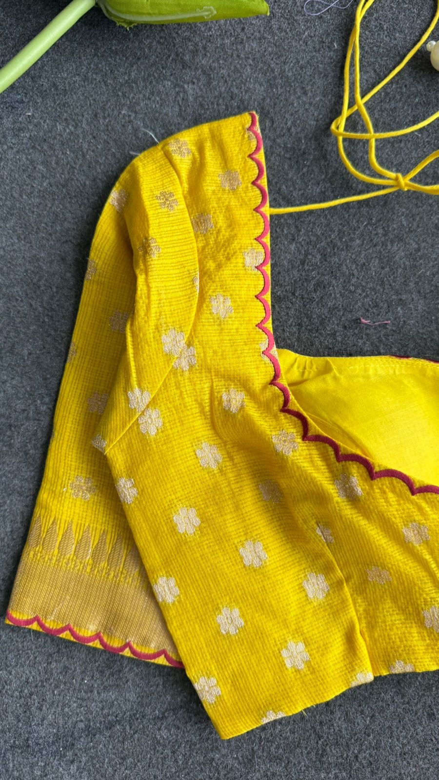 Red soft kota silk saree with yellow embroidered blouse