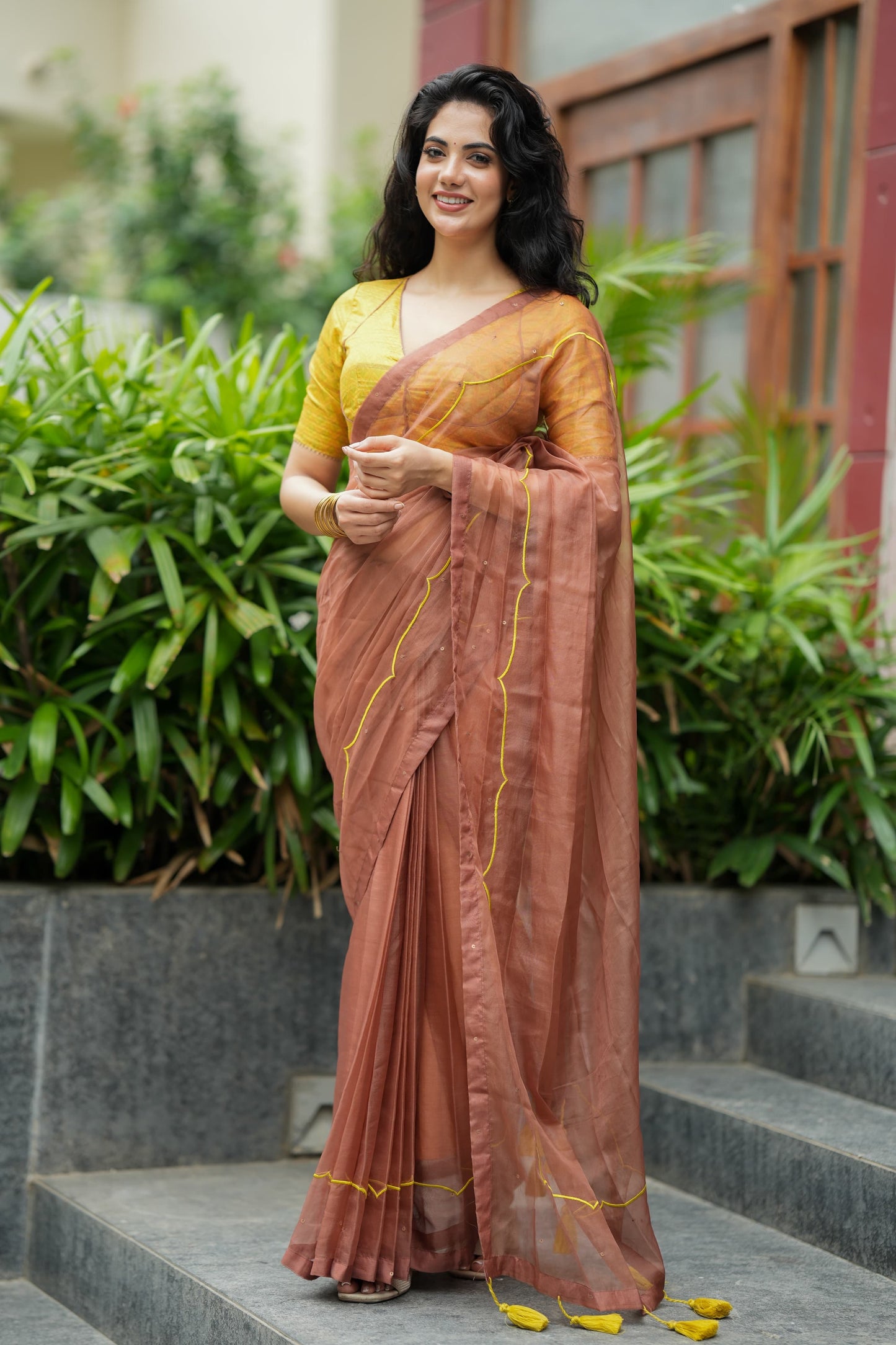Brown soft organza saree with lime green ikkat blouse