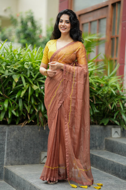 Brown soft organza saree with lime green ikkat blouse