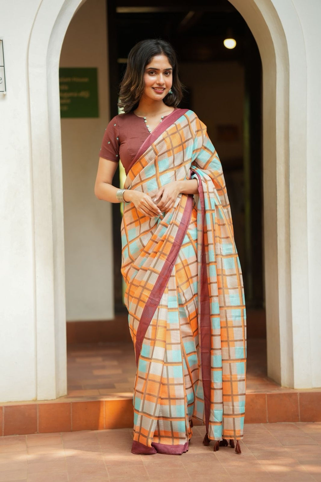 Multi checked kota saree with brown embroidery blouse