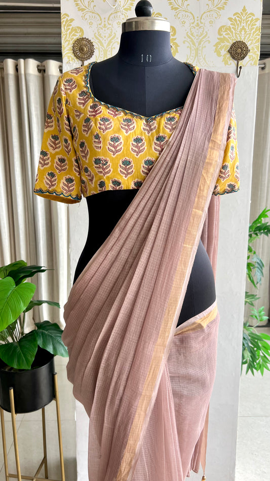 Light peach mul kota saree with yellow hand work blouse