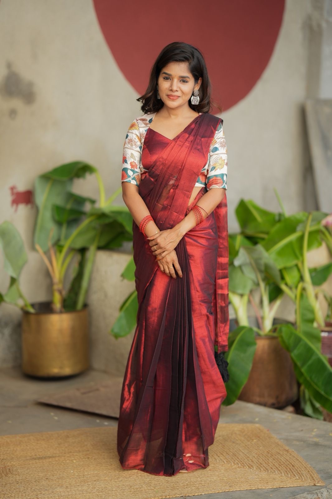 Wine soft tissue saree with floral blouse