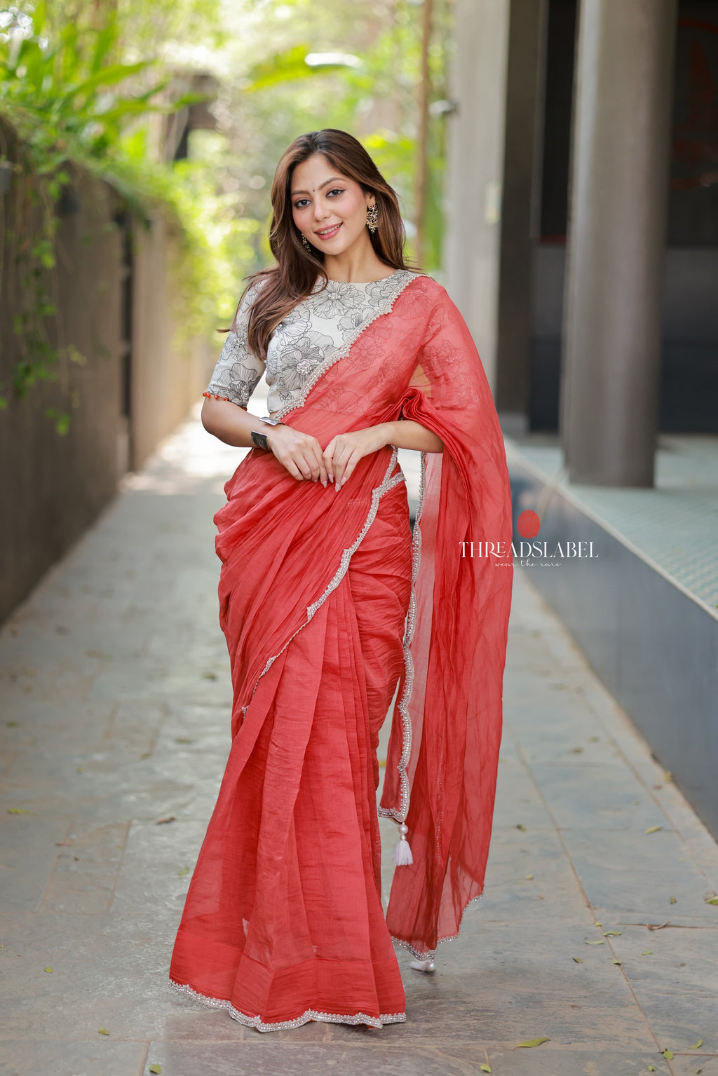 Orange rust saree with pearl work blouse