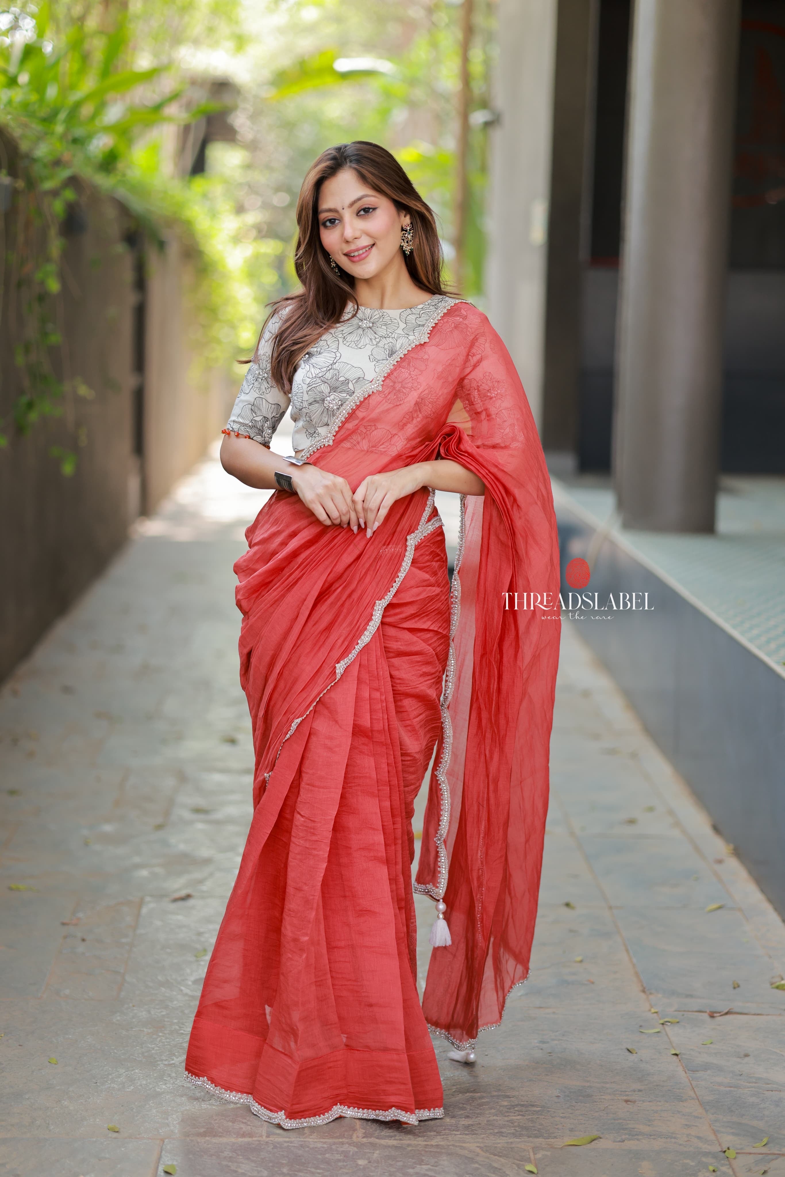 Orange rust saree with pearl work blouse