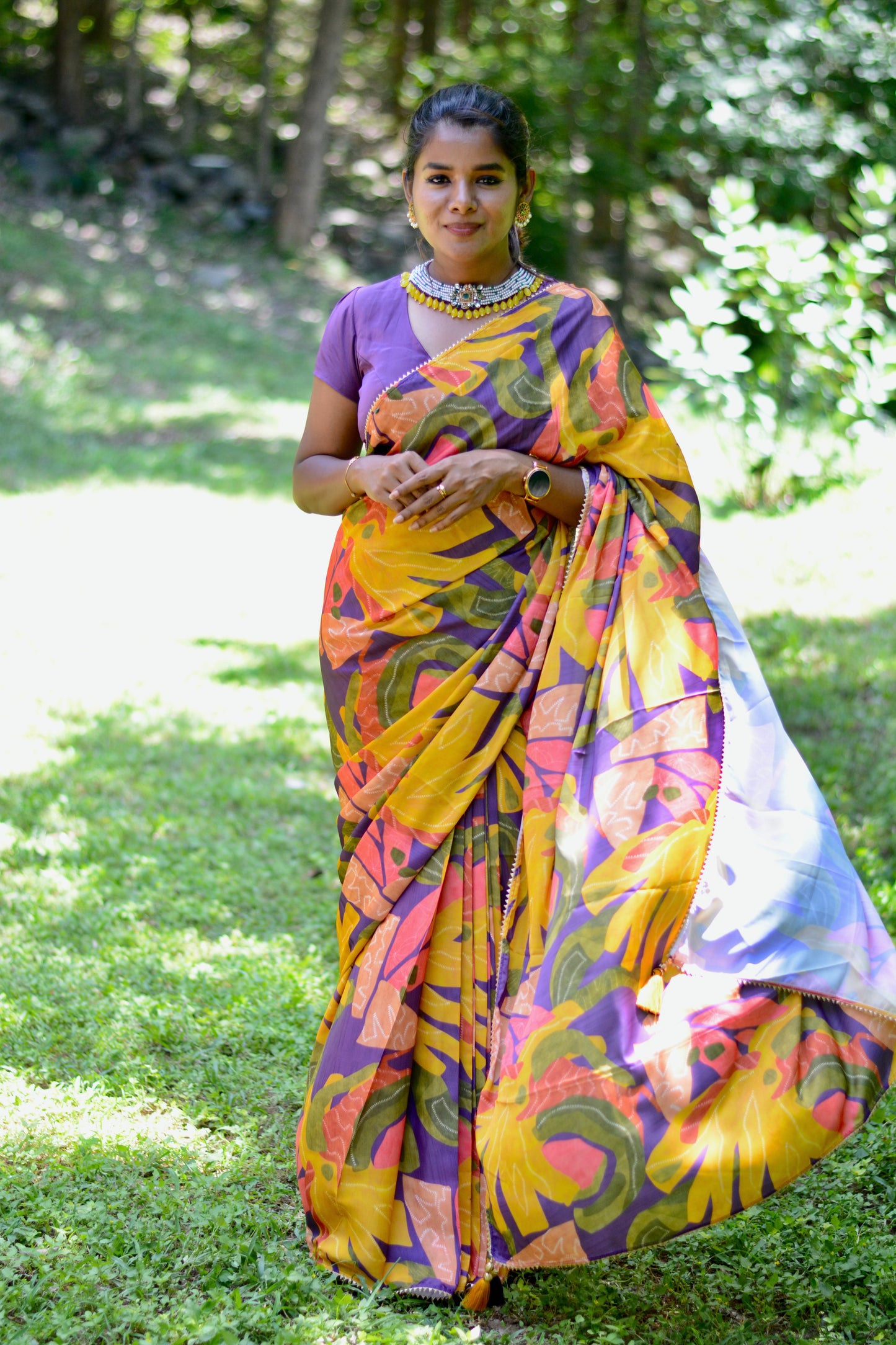 Yellow floral satin saree with purple jewel neck hand work blouse