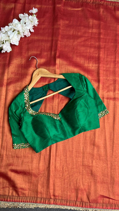 Red tissue saree with green hand work blouse