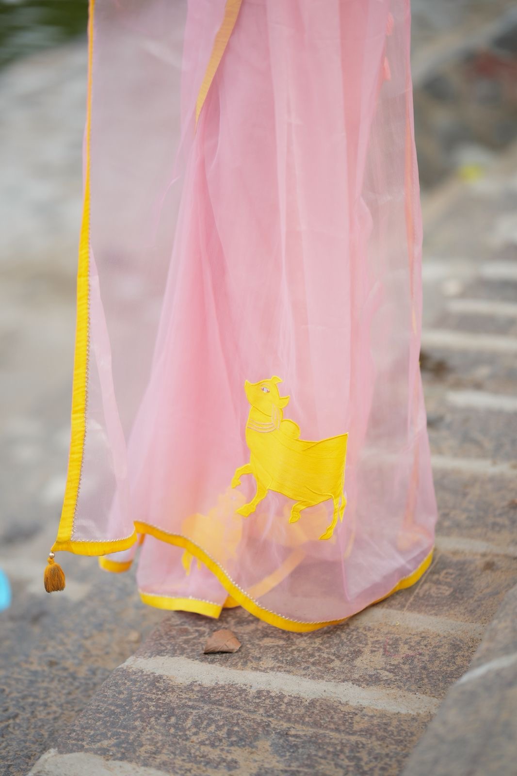 Peach organza saree with yellow hand work blouse