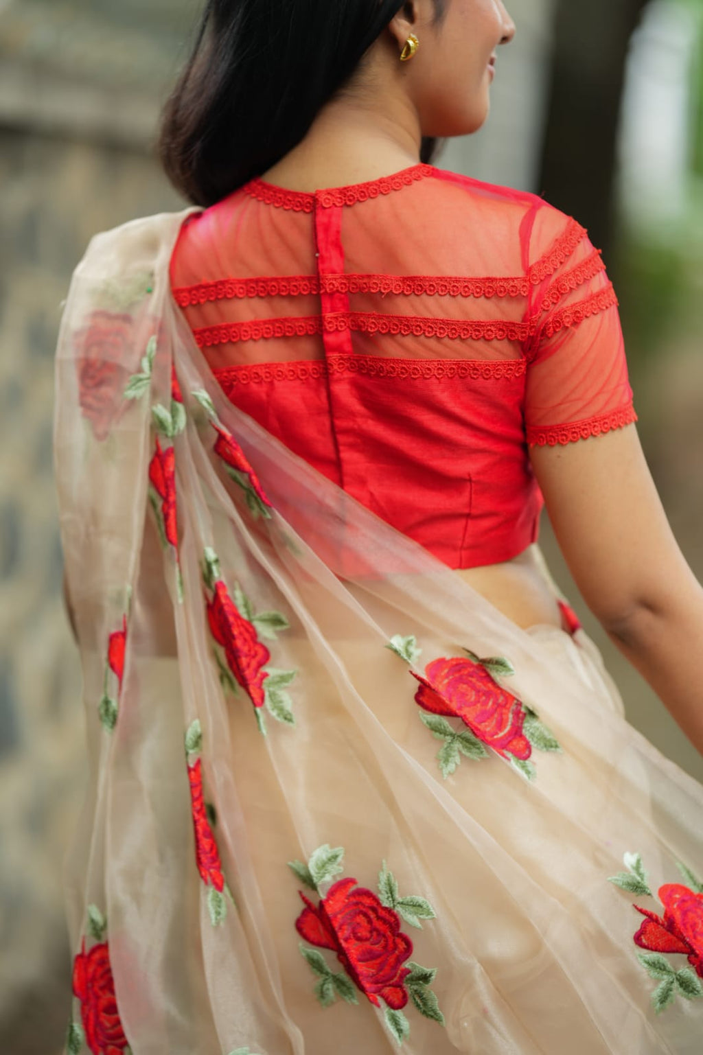 Glossy organza saree with red embroidery blouse