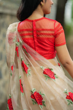 Glossy organza saree with red embroidery blouse