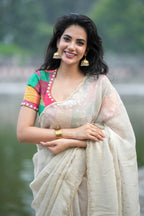 Beige georgette tissue saree with multi hand work blouse