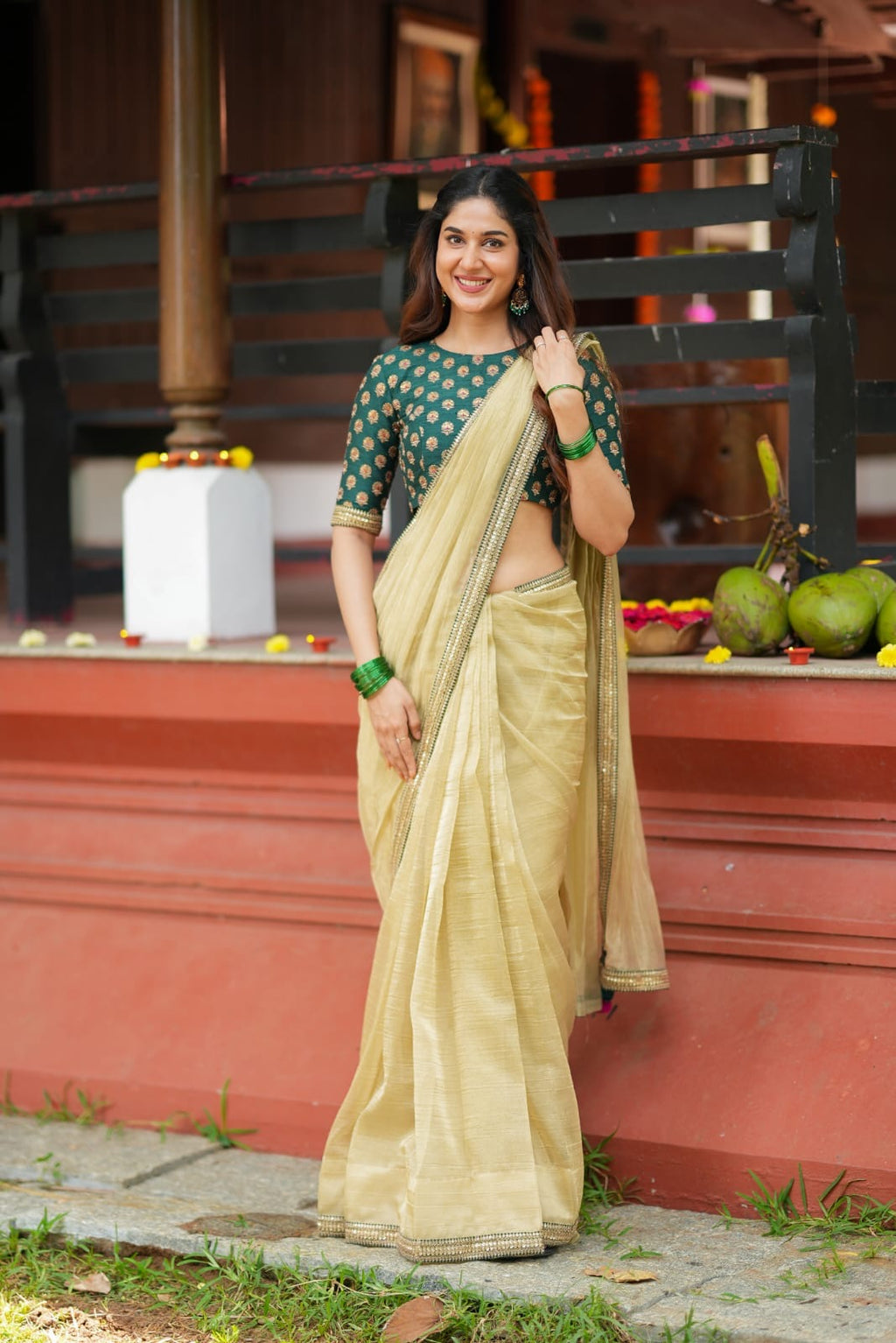 Gold tissue saree with green hand work blouse