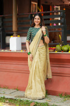 Gold tissue saree with green hand work blouse