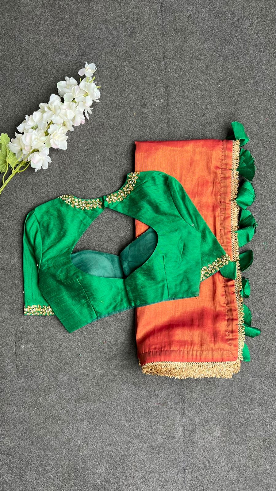 Red tissue saree with green hand work blouse