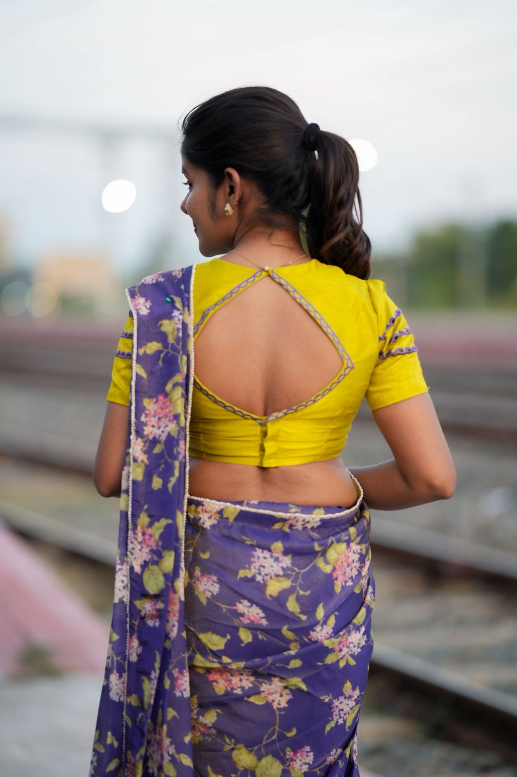 Blue floral tissue saree with lime hand work blouse