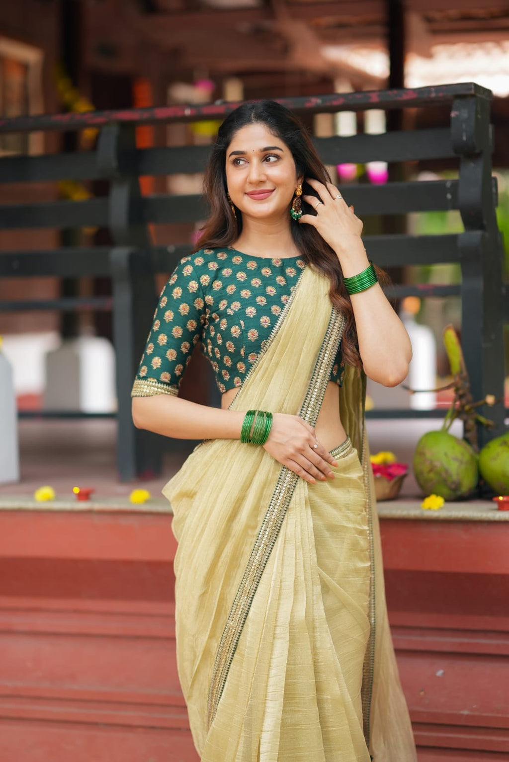 Gold tissue saree with green hand work blouse