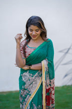 Green kota saree with kalamkari work blouse