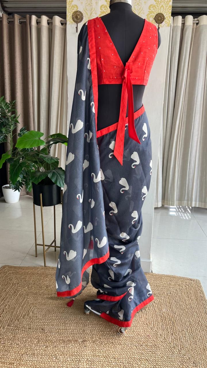 Grey kota doria saree with reddish hand worked blouse