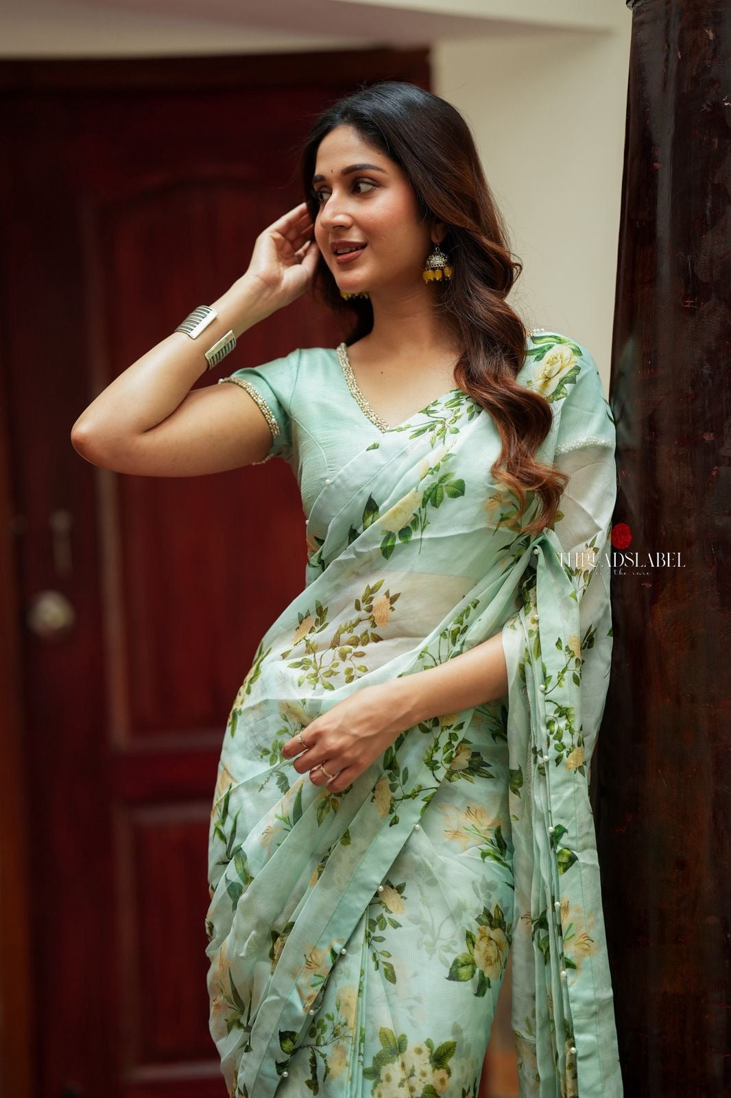 Sea green viscose jute floral saree (only saree)