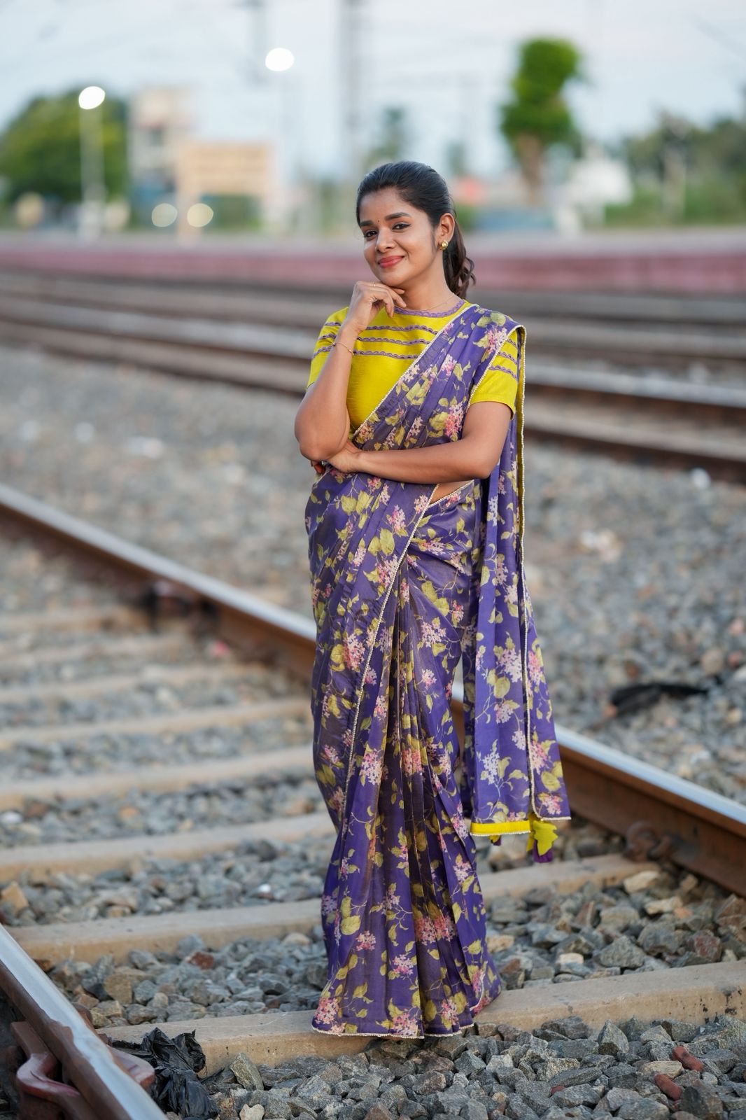 Blue floral tissue saree with lime hand work blouse