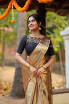 Golden tissue saree with black hand work blouse