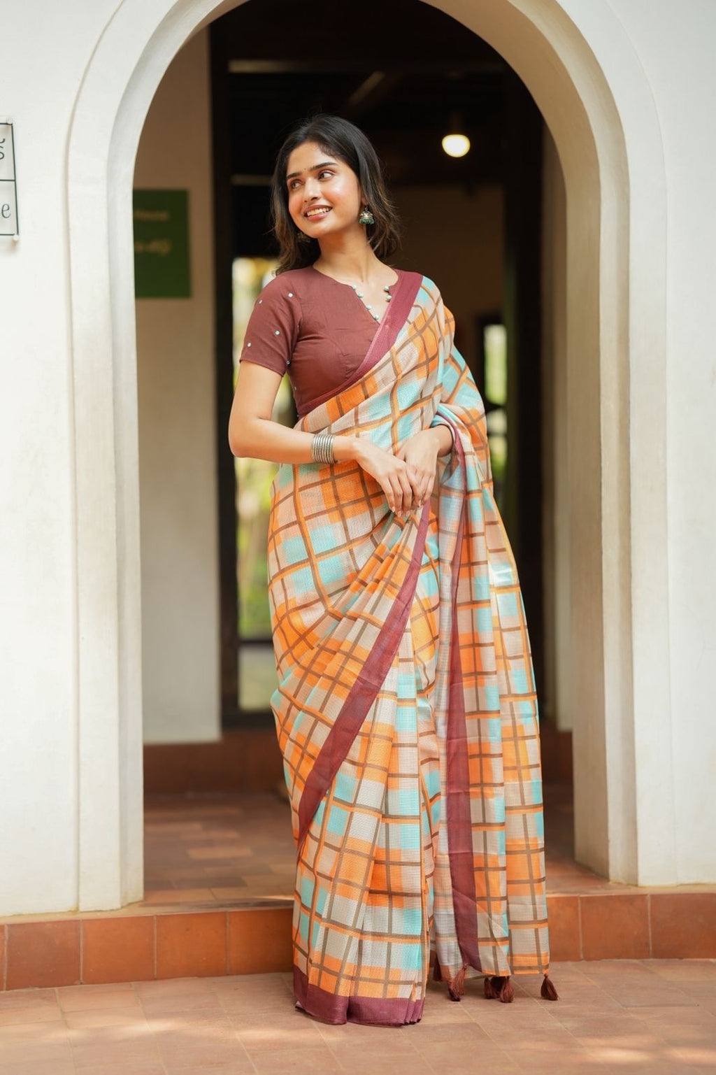 Multi checked kota saree with brown embroidery blouse