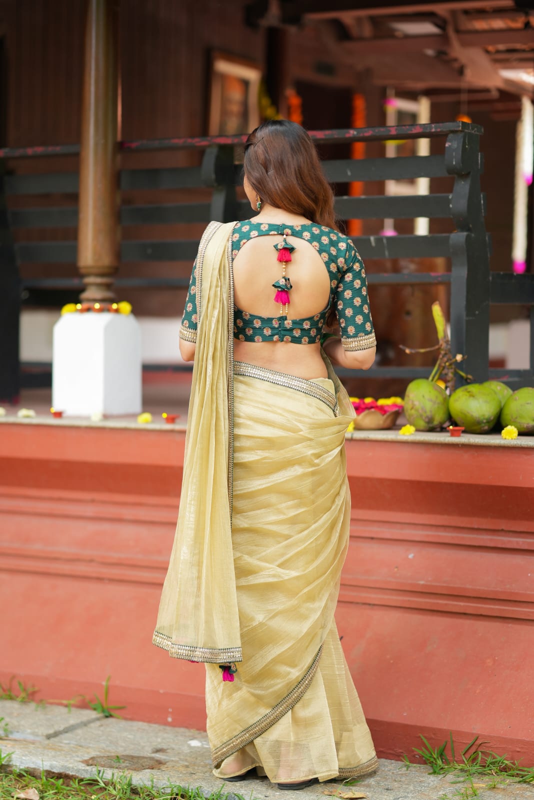 Gold tissue saree with green hand work blouse