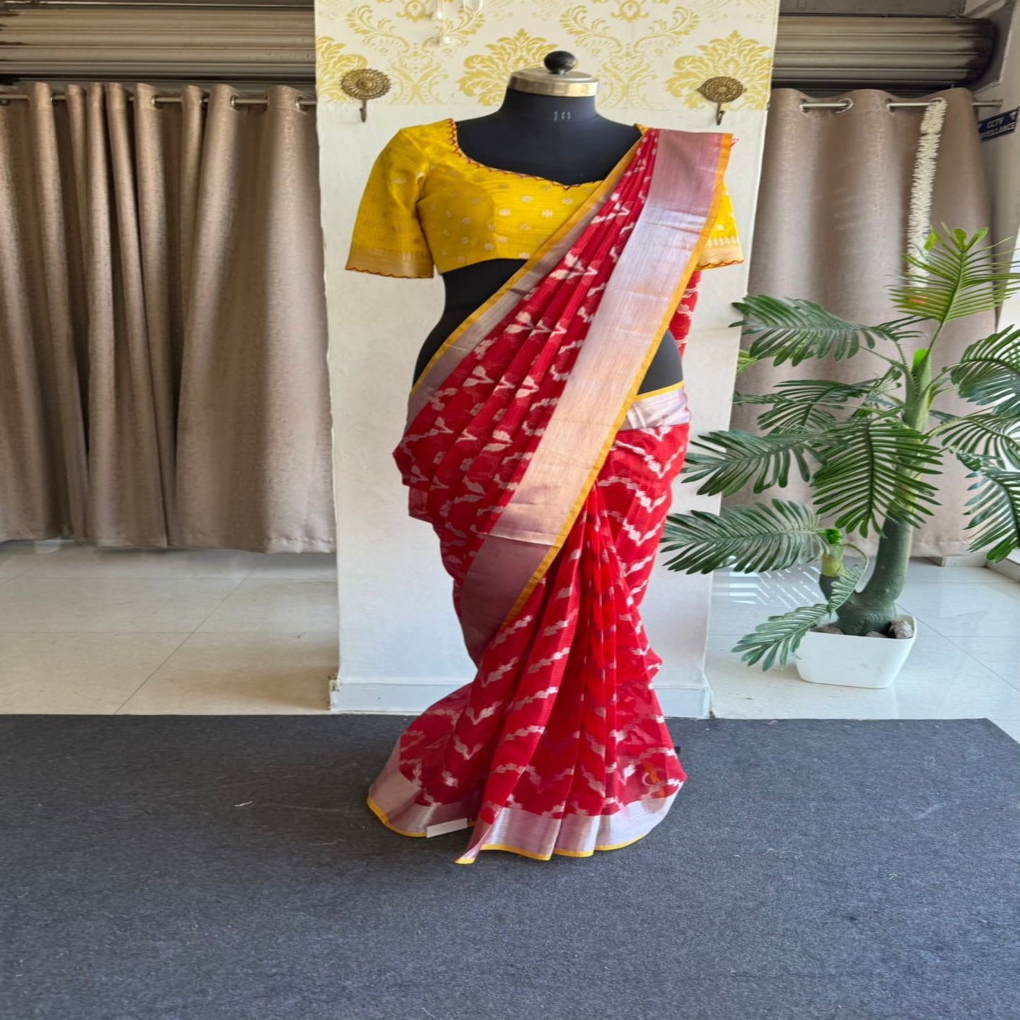 Red soft kota silk saree with yellow embroidered blouse