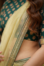 Gold tissue saree with green hand work blouse