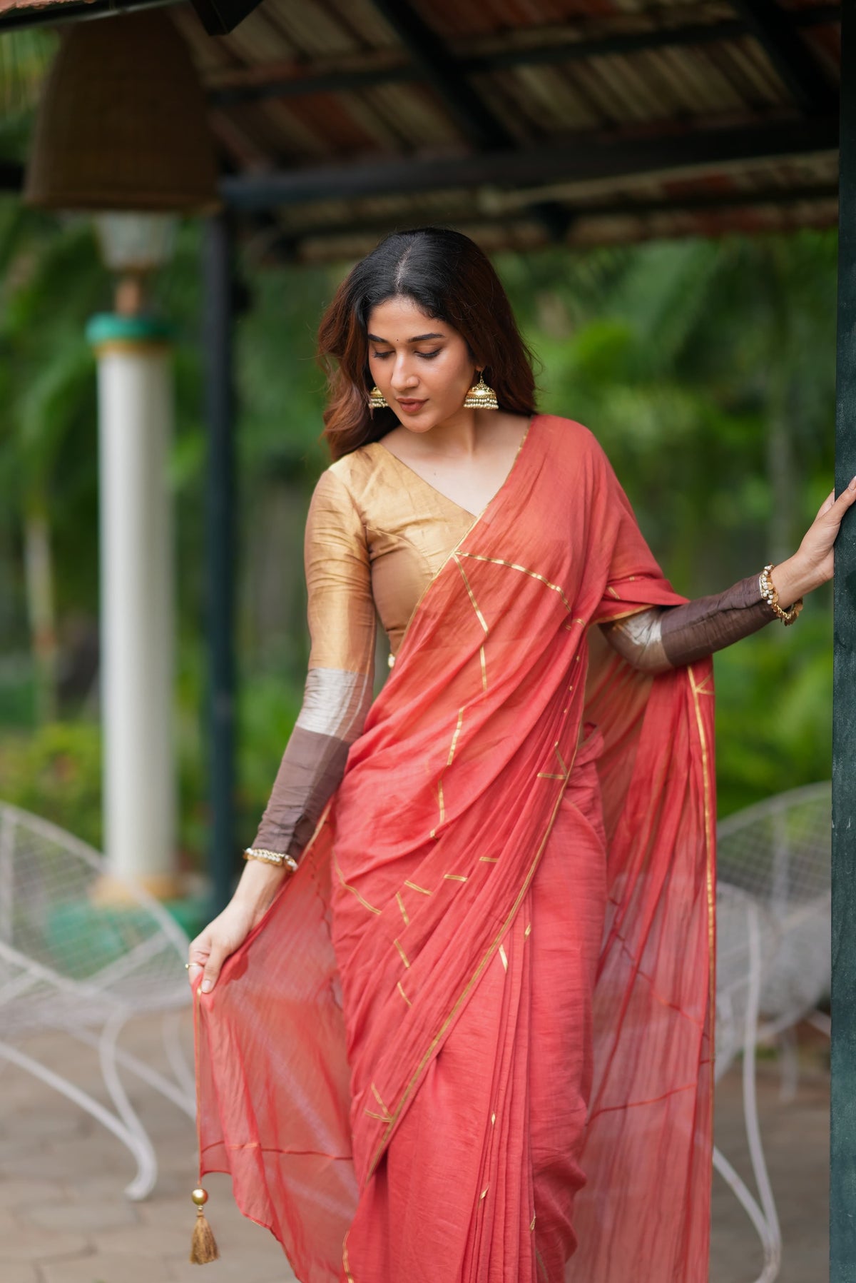 Orange rust saree with tissue handwork blouse