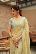 Western yellow & blue chiffon striped saree with hand work blouse