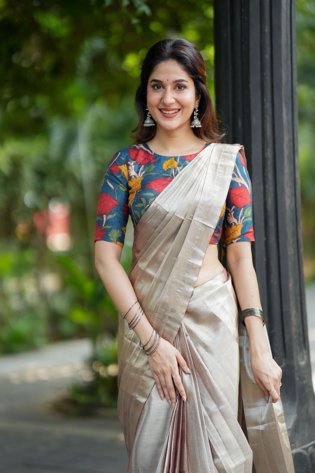 Silver soft tissue saree with blue kalamakari blouse