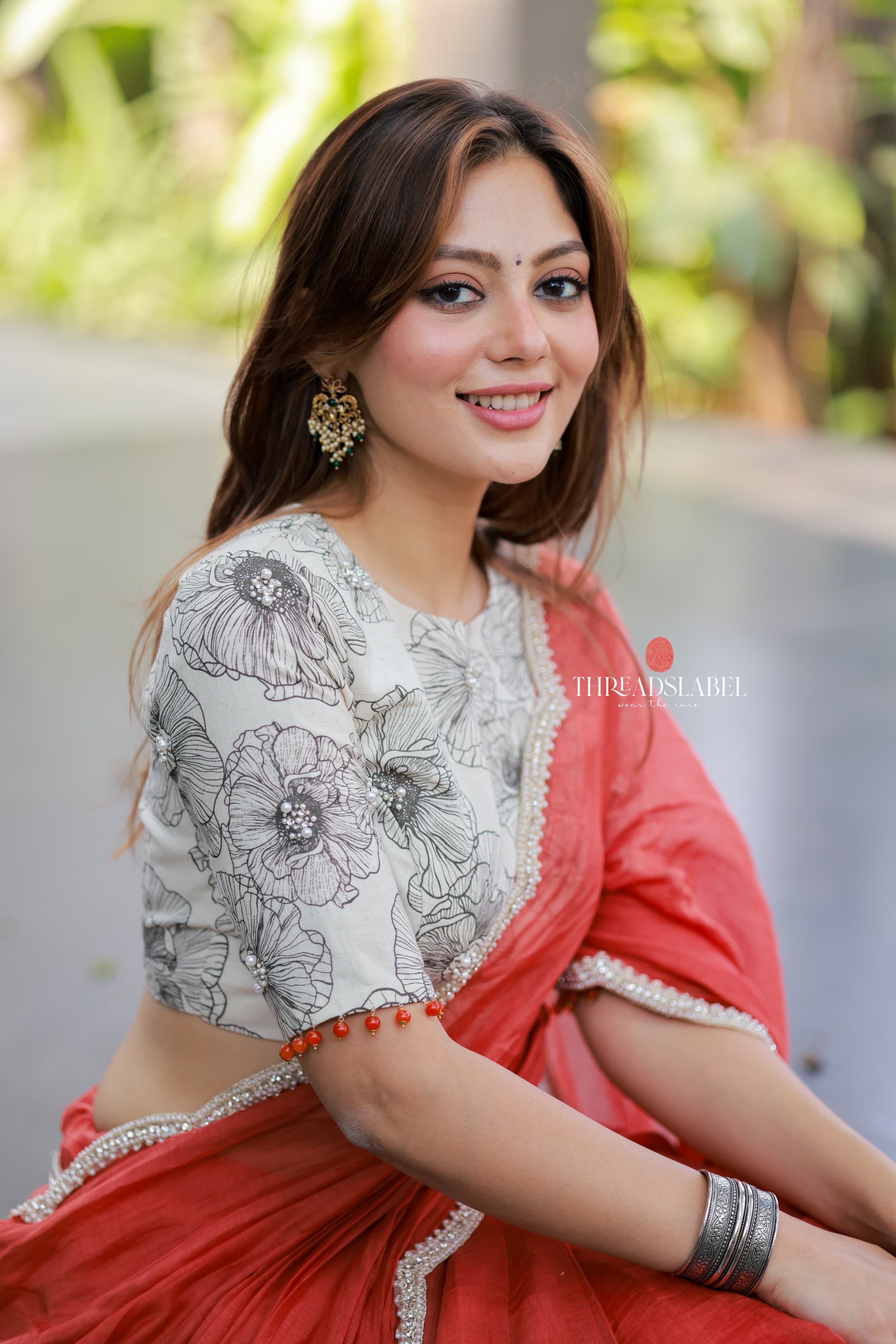 Orange rust saree with pearl work blouse