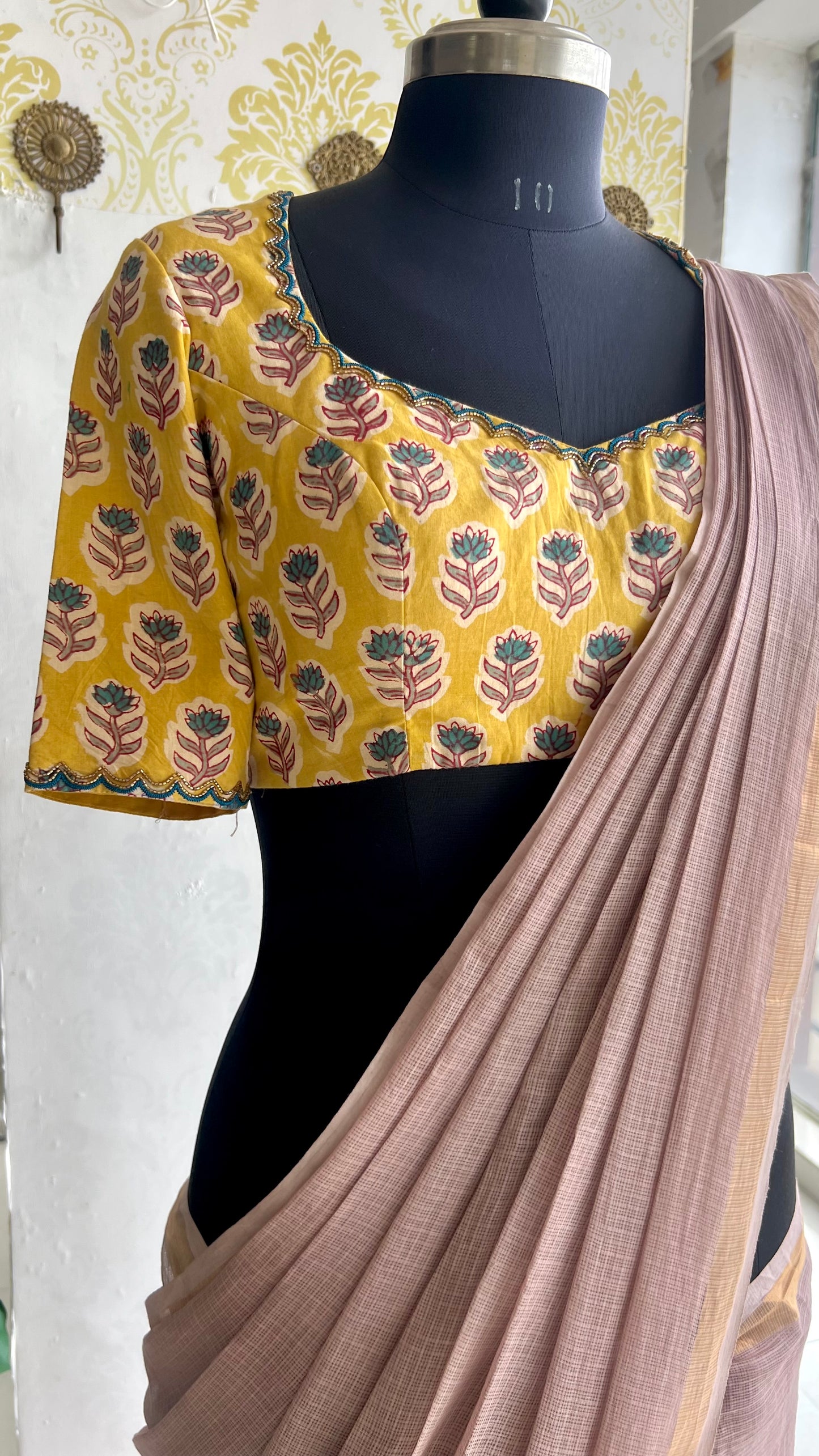 Light peach mul kota saree with yellow hand work blouse
