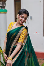 Green organza saree with yellow hand work blouse