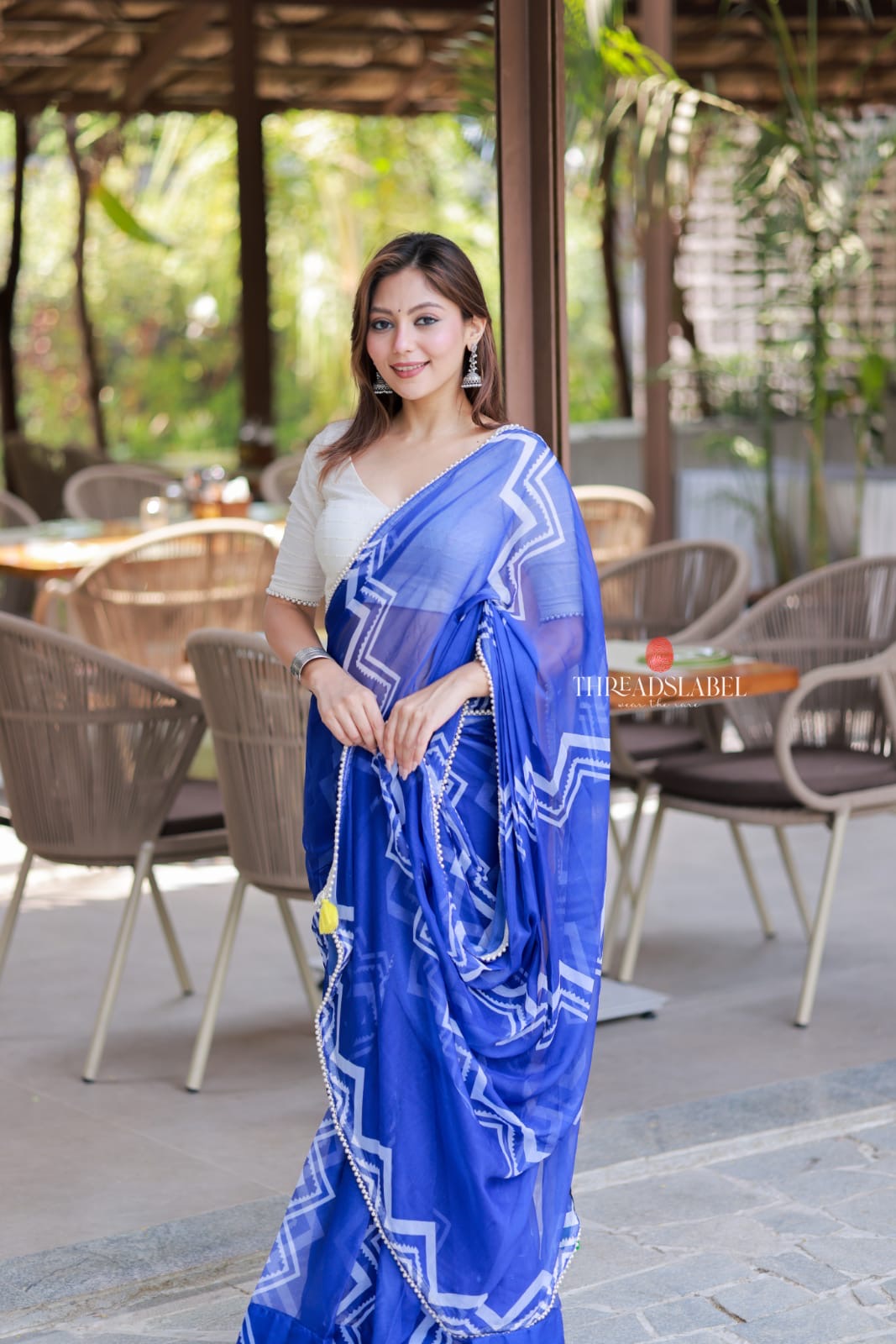 Blue chiffon saree with white embroidery blouse