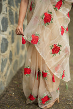 Glossy organza saree with red embroidery blouse