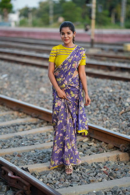 Blue floral tissue saree with lime hand work blouse