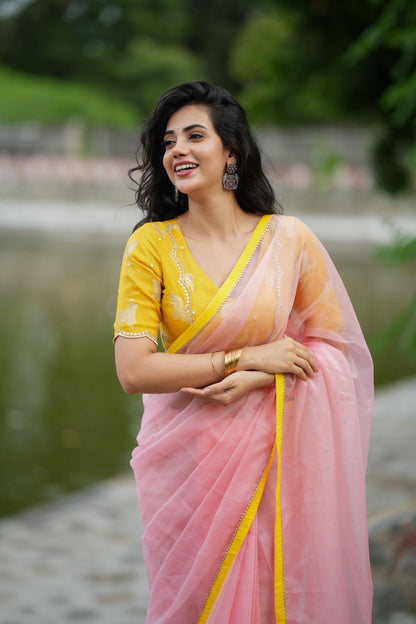Peach organza saree with yellow hand work blouse