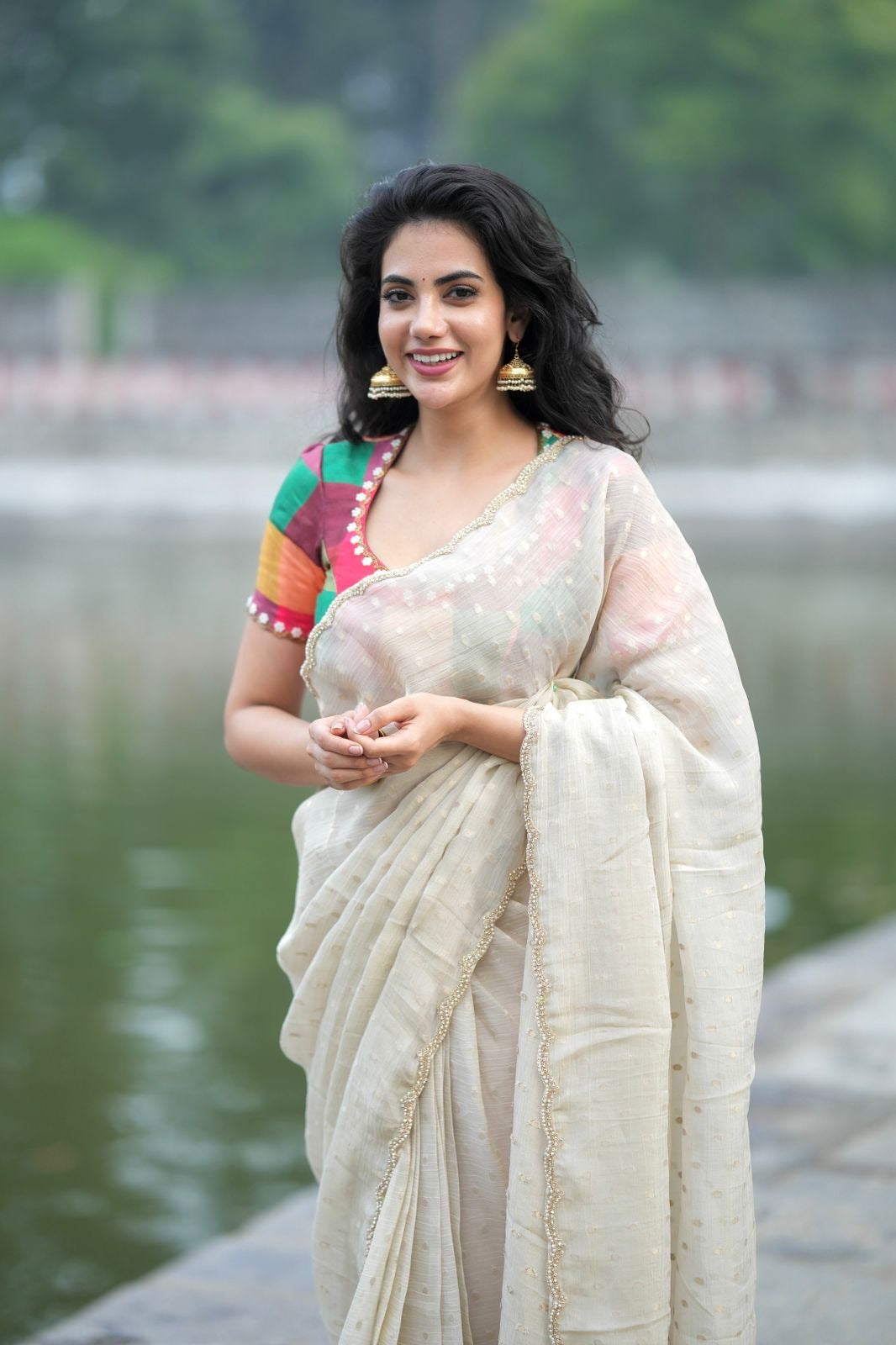 Beige georgette tissue saree with multi hand work blouse