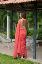 Orange rust saree with tissue handwork blouse